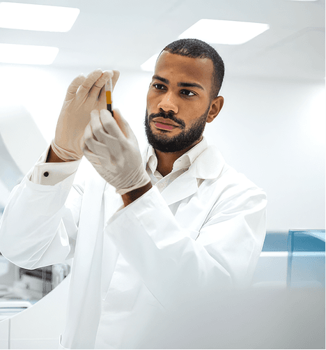 Scientist inspecting a sample vial in the laboratory