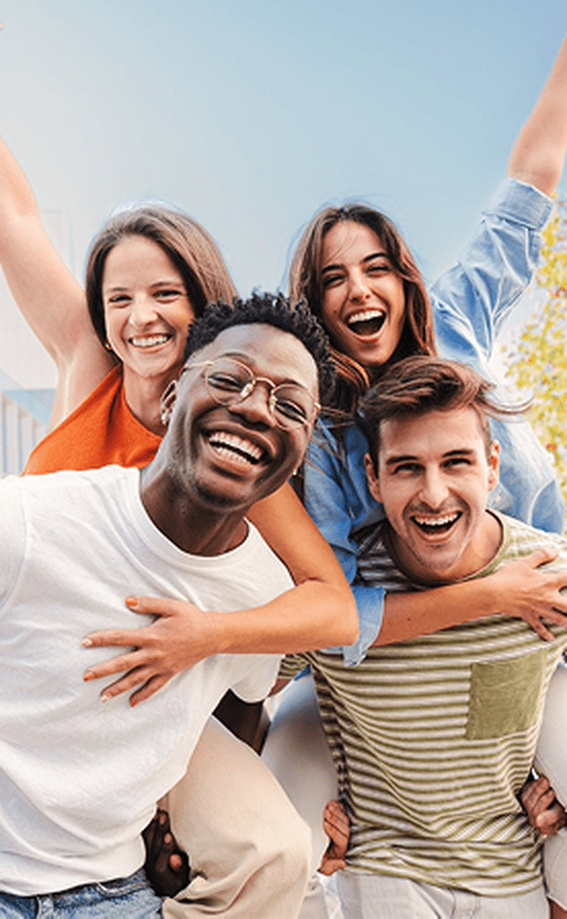 Diverse group of young people smiling outdoors